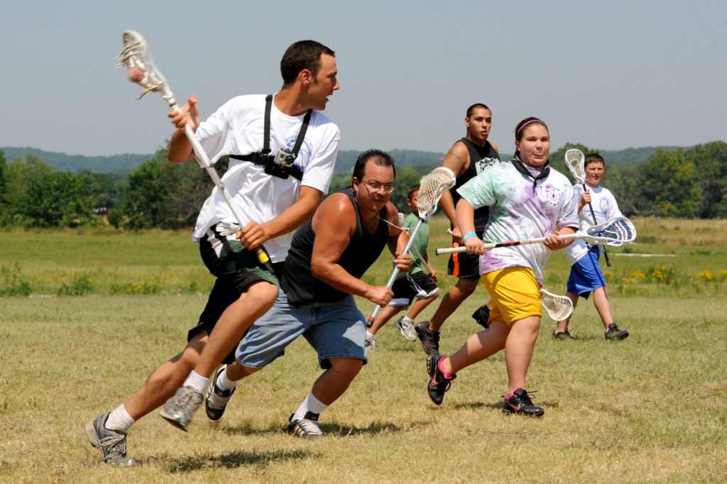 Miami and Seneca-Cayuga lacrosse players during a game.