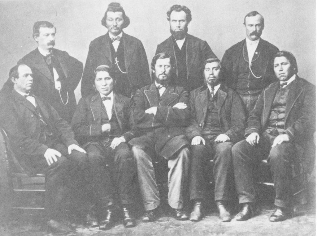 The “Western Chiefs Delegation” photo from left to right standing: Charles Schooler Beeson (clerk at the agency), Thomas F. Richardville, G. Adolphus Colton (Indian Agent), and Captain Sims* (local U.S. Army officer).  Sitting from left to right: David Geboe, Peter Lafalia, John B. Roubideaux, Thomas Miller, and Louis Lafontaine*.  Those names marked with * still need additional confirmation before we can say with 100% certainty that the identification is correct.  