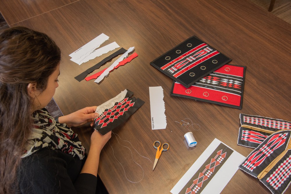 Kara Strass working on her latest ribbonwork project.