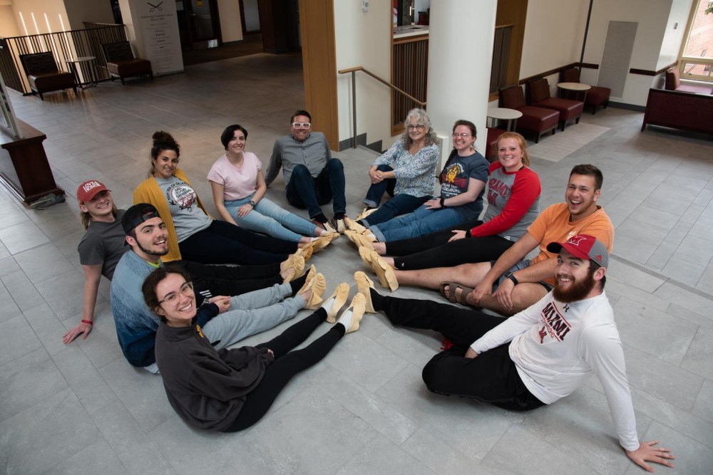 Participants in the 2019 Myaamia mahkisina workshop wearing their completed mahkisina