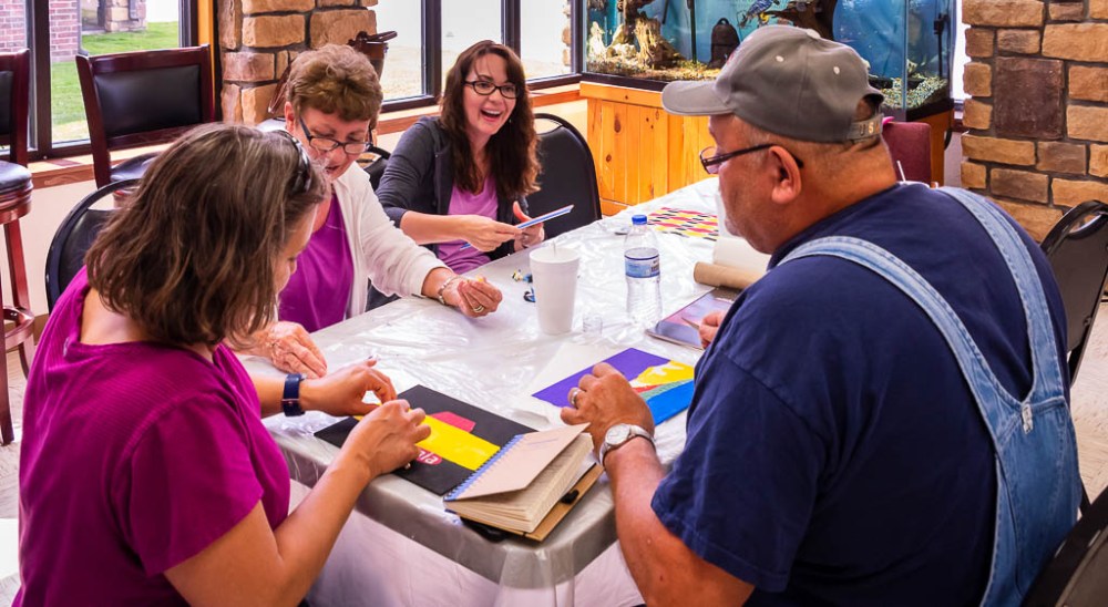 Participants of the 2019 Adult Experience painting Myaamia designs