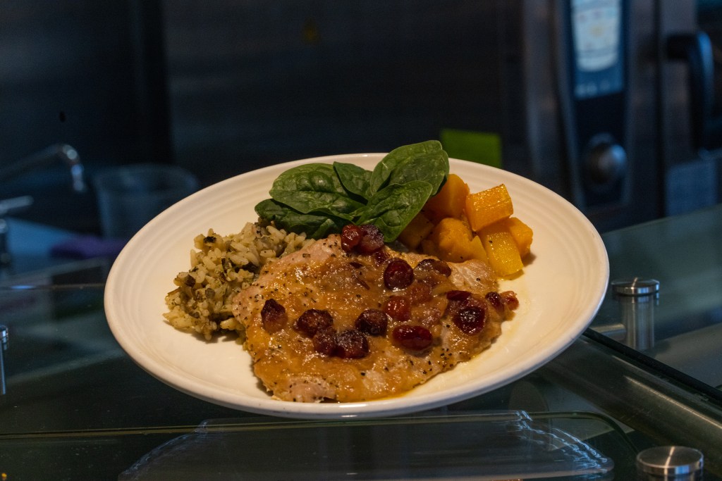 Turkey cutlet with cranberry sauce, wild rice, and squash