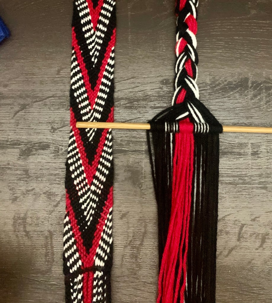 A woven garter with a completed section on the left and an in progress section on the right