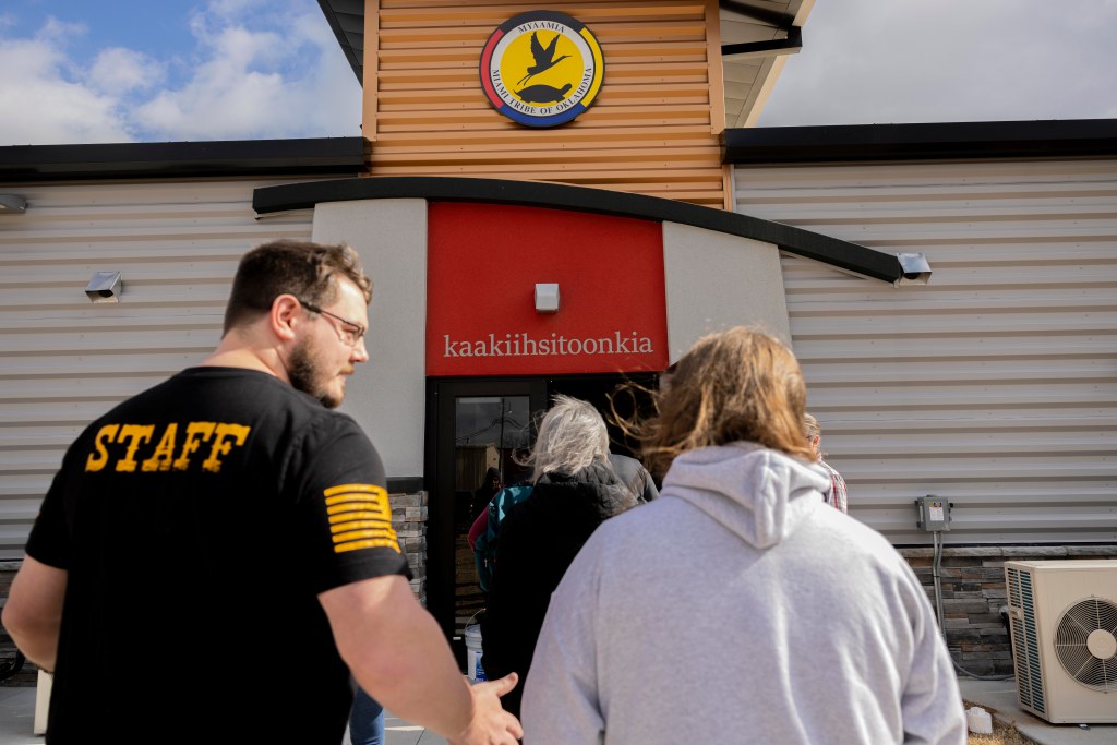 People walking into a building