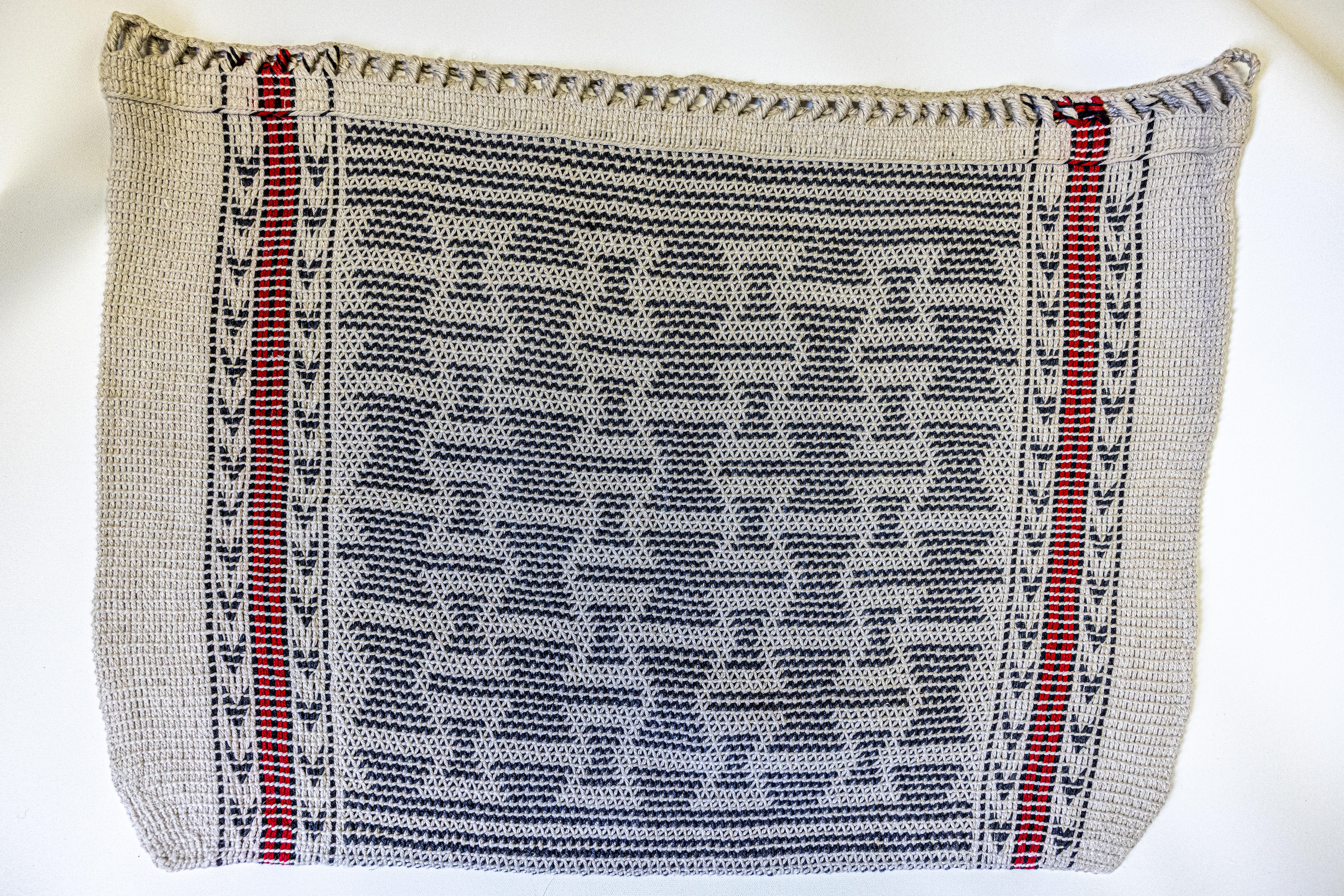 Twined bag featuring hourglass shapes