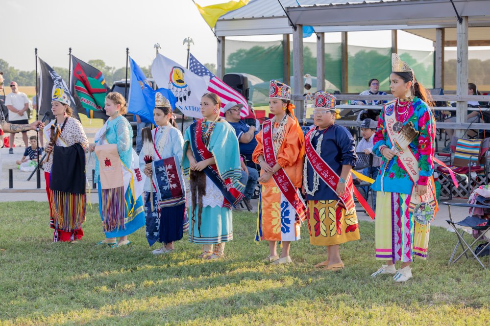Young women lined up in their regalia