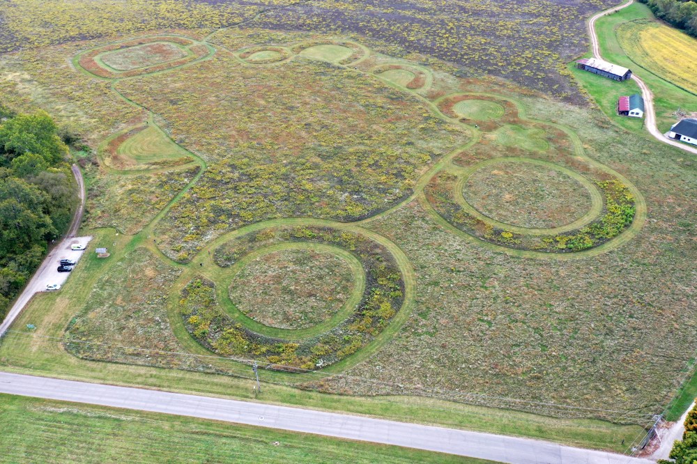 Arial view of a large field with designs created by mowing
