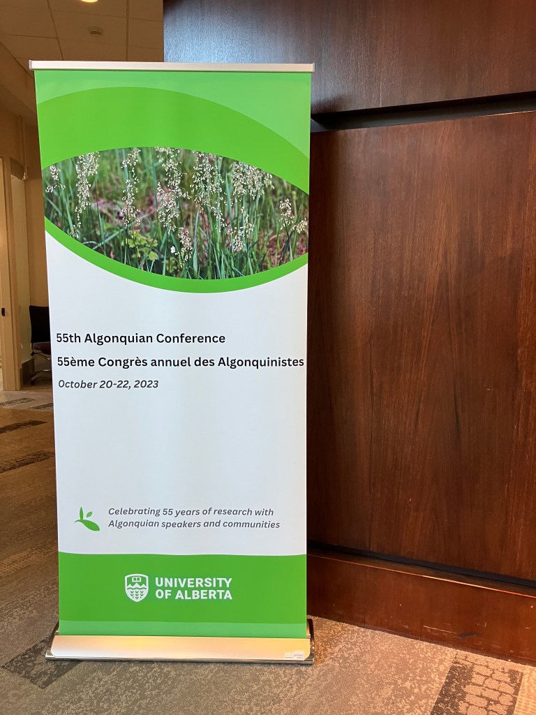 A large vertical banner that reads "55th Algonquian Conference" in English and French