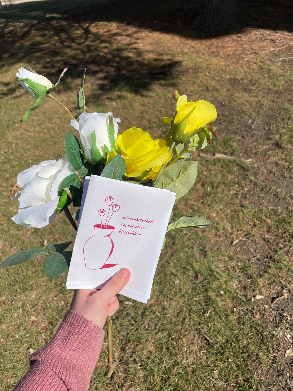 Yellow and white flowers with a Valentine's Day Card