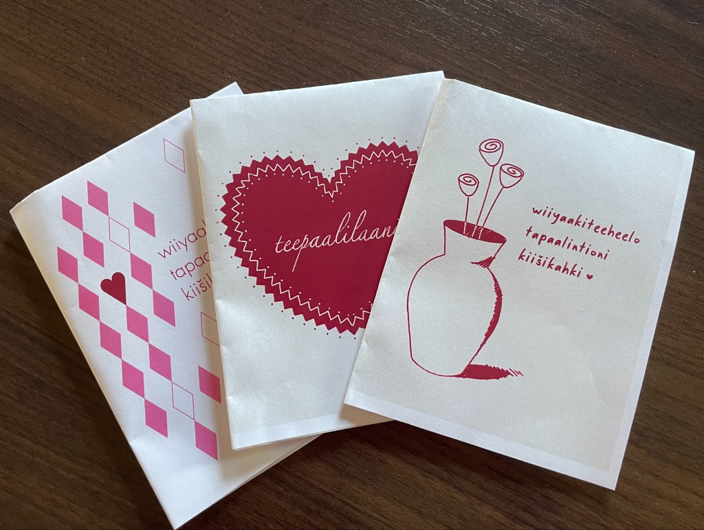 Three card options spread out on a table.