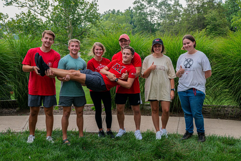 7 people pose for a photo together