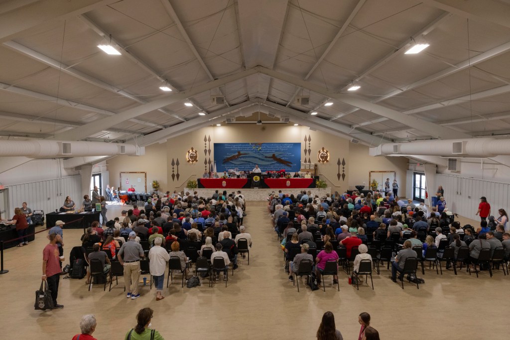 Chief Lankford stands at podium, addressing a crowd of over 200 people