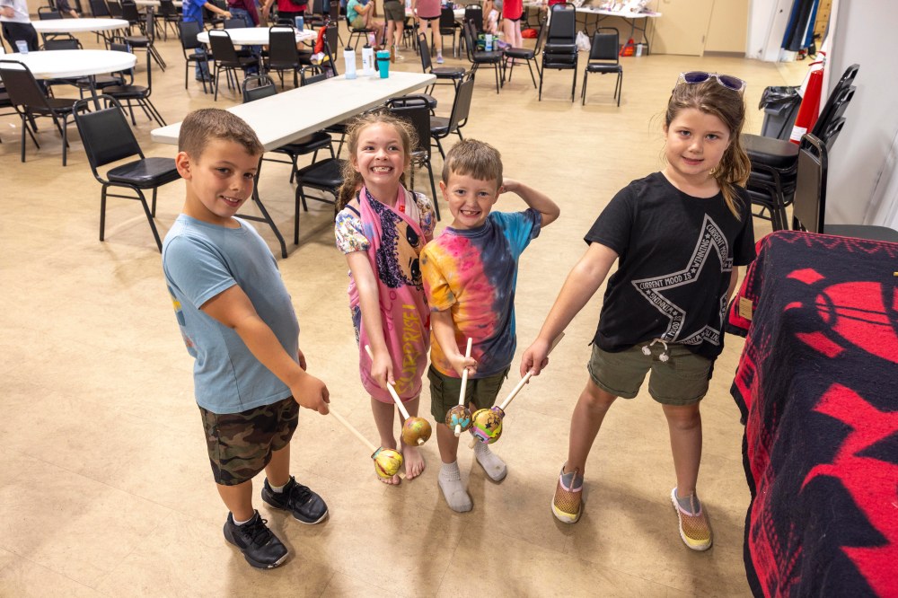 Youth participants pose with gourd rattles