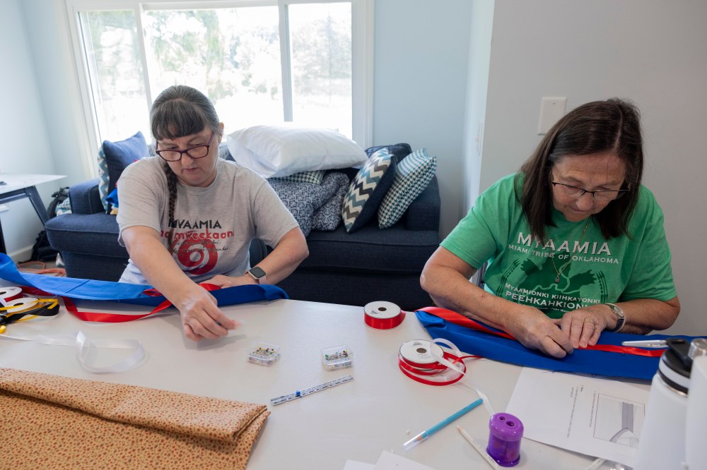 Two adult participants sewing
