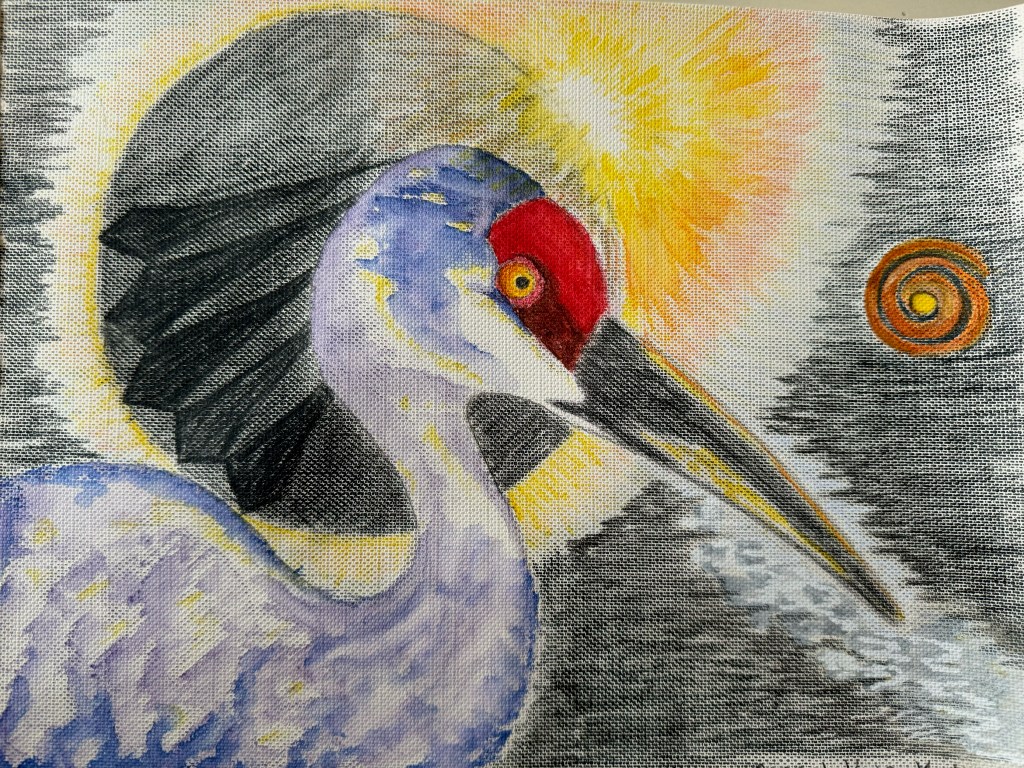 A blue crane with a red head stands in front of the sun