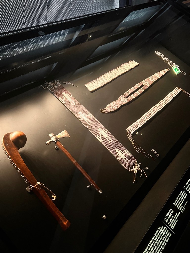 Sashes, clubs, and axes on display