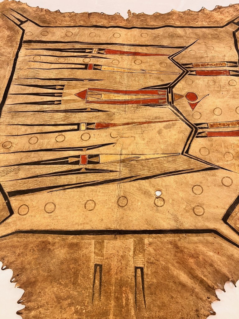 Black, yellow, and red patterns against the tan hide