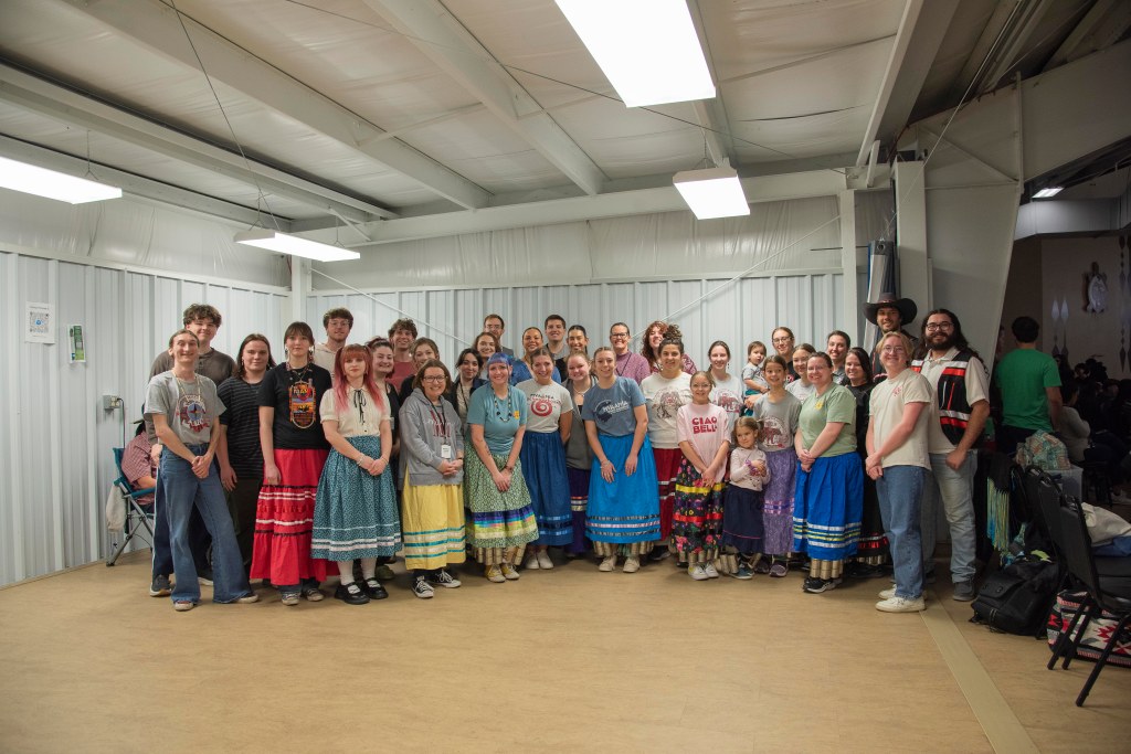 A group of people prepare to stomp