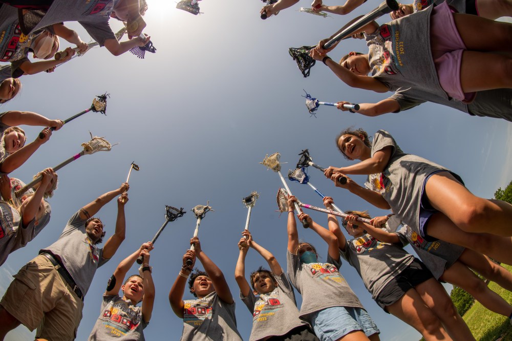 Myaamia youth start a game of lacrosse