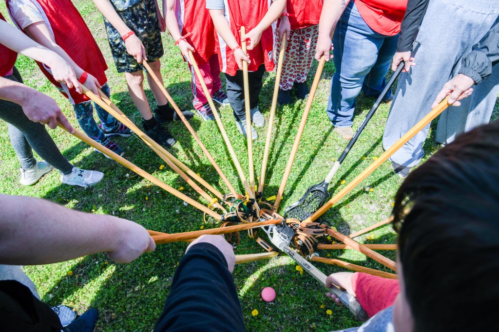 Lacrosse sticks gathered