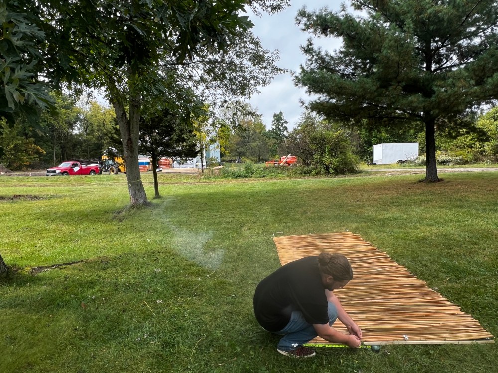 Weaving a cattail mat
