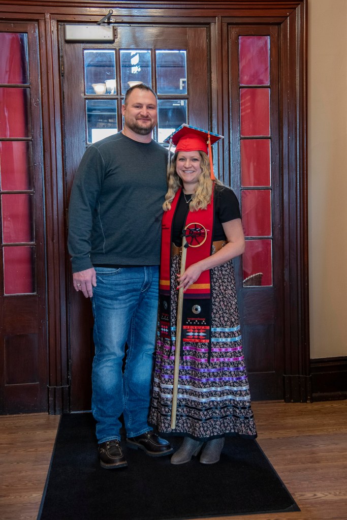 Kayla Becker with husband at graduation