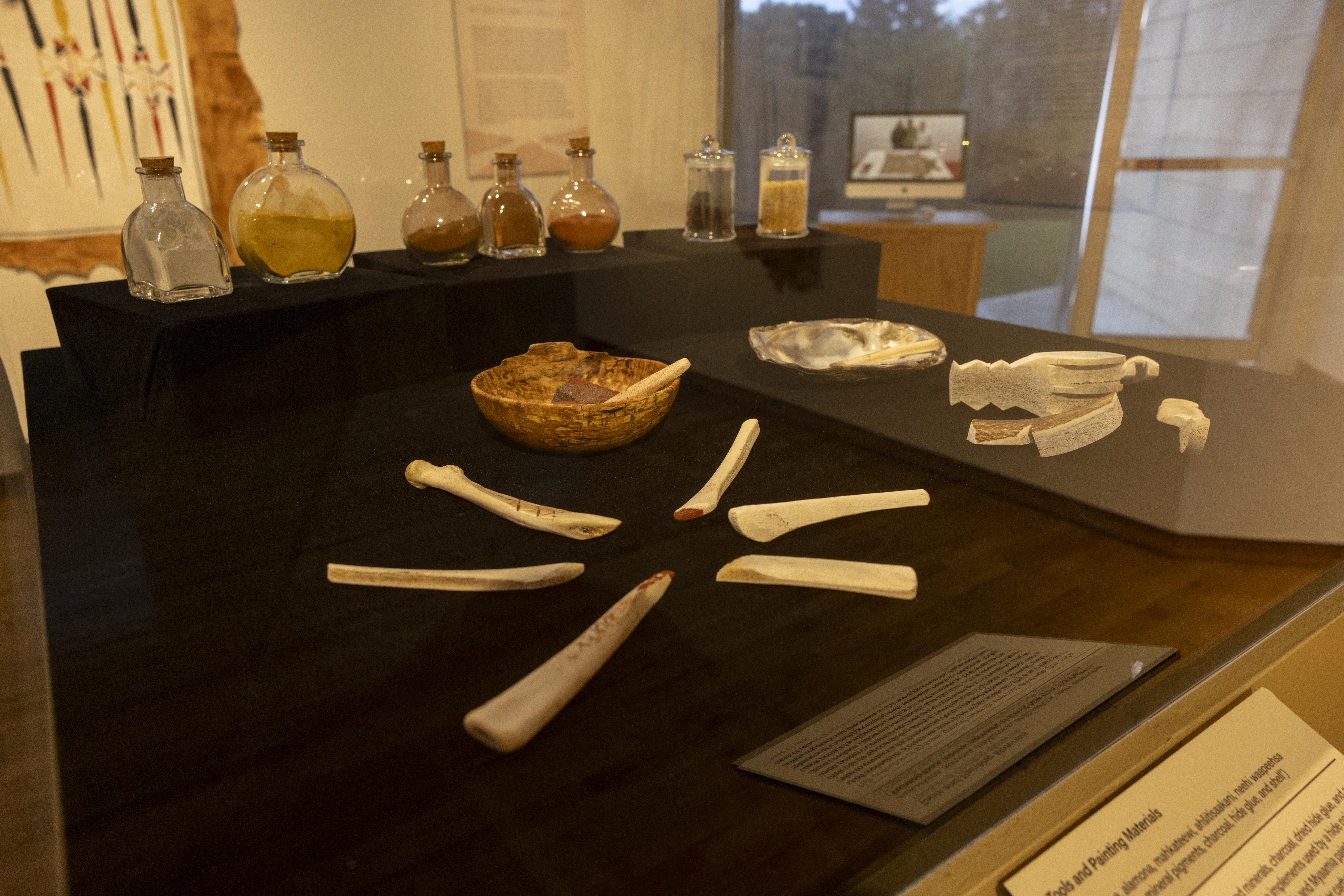 Jarred pigments displayed with painting tools