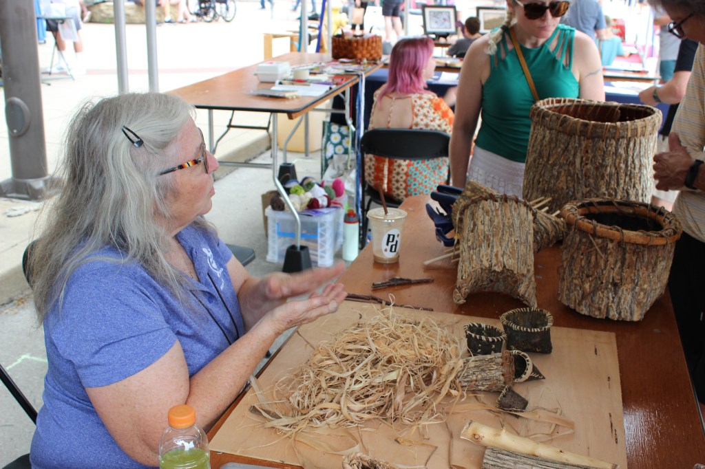 Dani with tree bark baskets